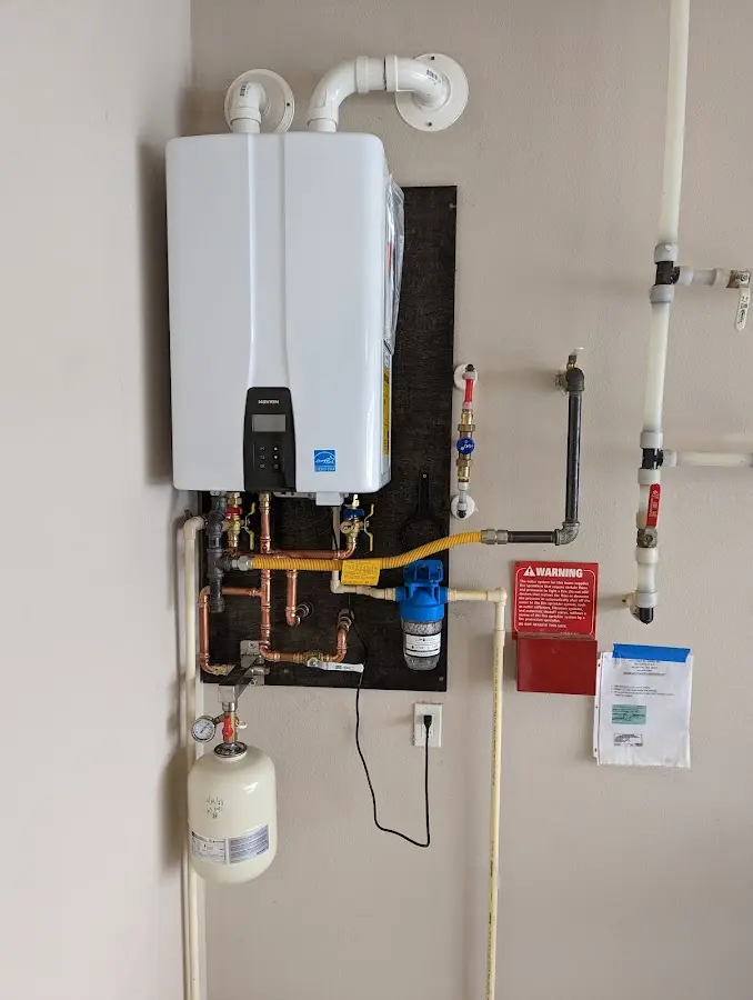 Professional plumber installing copper piping in a Lake Norman of Iredell home